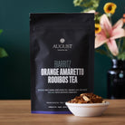Biarritz Orange Amaretto Rooibos Tea by August Uncommon Tea, caffeine-free herbal tea in a 15-cup bag, with vibrant orange and herbal blend.