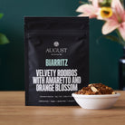 Biarritz Orange Amaretto Rooibos Tea bag by August Uncommon Tea, caffeine-free herbal tea with orange and amaretto flavor.