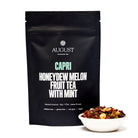 August Uncommon Tea Capri Honeydew Melon Mint Herbal Tea in a 15-cup bag, caffeine-free beverage with fresh melon and mint flavors.