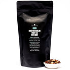 August Uncommon Tea Capri Honeydew Melon Mint Tea in a tea bag, caffeine-free herbal tea with fresh melon and mint flavors.