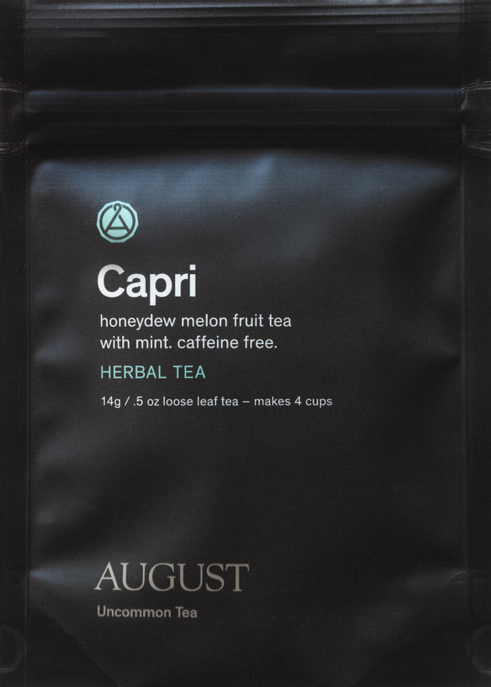 August Uncommon Tea Capri Honeydew Melon Mint Herbal Tea in a 15-cup bag, caffeine-free, with fresh melon and mint ingredients.