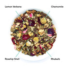 Box of August Uncommon Tea Days of Heaven Rhubarb Verbena Chamomile Caffeine-Free Herbal Tea bags, with tea leaves and packaging.