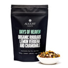 August Uncommon Tea Days of Heaven Rhubarb Verbena Chamomile Herbal Tea bag, caffeine-free, with dried herbs and vibrant packaging.