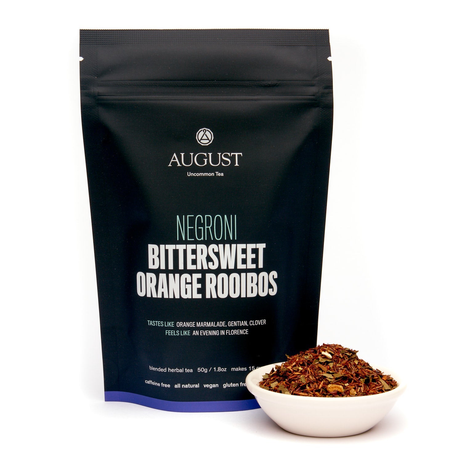 Caffeine-free Negroni herbal tea by August Uncommon Tea with orange and rooibos, in a 15-cup bag, ready for brewing.