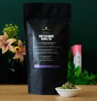 Olympus Mint Cucumber Herbal Tea by August Uncommon Tea, caffeine-free herbal tea in a 15-cup bag, with fresh mint and cucumber visuals