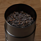 Black Pearl Oolong Tea tin by August Uncommon Tea, single estate Taiwanese dark roasted oolong beverage with loose tea leaves.