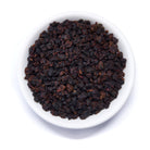 Black Pearl Taiwanese Dark Roasted Oolong Tea from August Uncommon Tea in a 150g tin, showcasing dark roasted tea leaves.