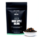 August Uncommon Avalon Burnt Apple Oolong Tea in a tin, showcasing the tea leaves and packaging for this aromatic oolong beverage.