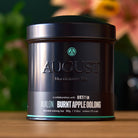 August Uncommon Tea Avalon Burnt Apple Oolong Tea in a 23-cup tin, showcasing dried tea leaves and rich, roasted apple aroma.