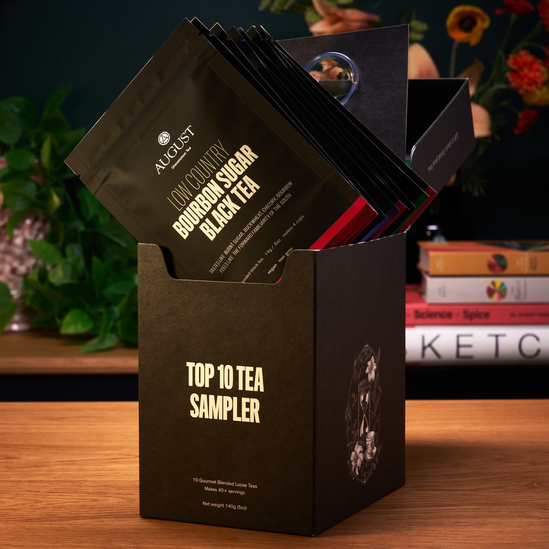Assorted tea sachets from August Uncommon Tea's Top 10 Sampler featuring ten trending teas in a colorful box.