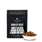 White tea tin labeled "Know by Heart" by August Uncommon Tea, featuring orange blossom and almond flavor for a fragrant beverage.
