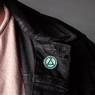 August Seal Enamel Pin from August Uncommon Tea swag collection, featuring a detailed seal design on a metal pin.