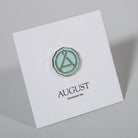 August Seal Enamel Pin from August Uncommon Tea swag collection, featuring a detailed, colorful seal design.