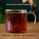 Clear glass mug from August Uncommon Tea, elegant teaware for hot beverages, showcasing its transparent design and sleek style.