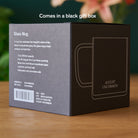 Clear glass mug from August Uncommon Tea, elegant teaware for hot beverages, showcasing a sleek and transparent design.