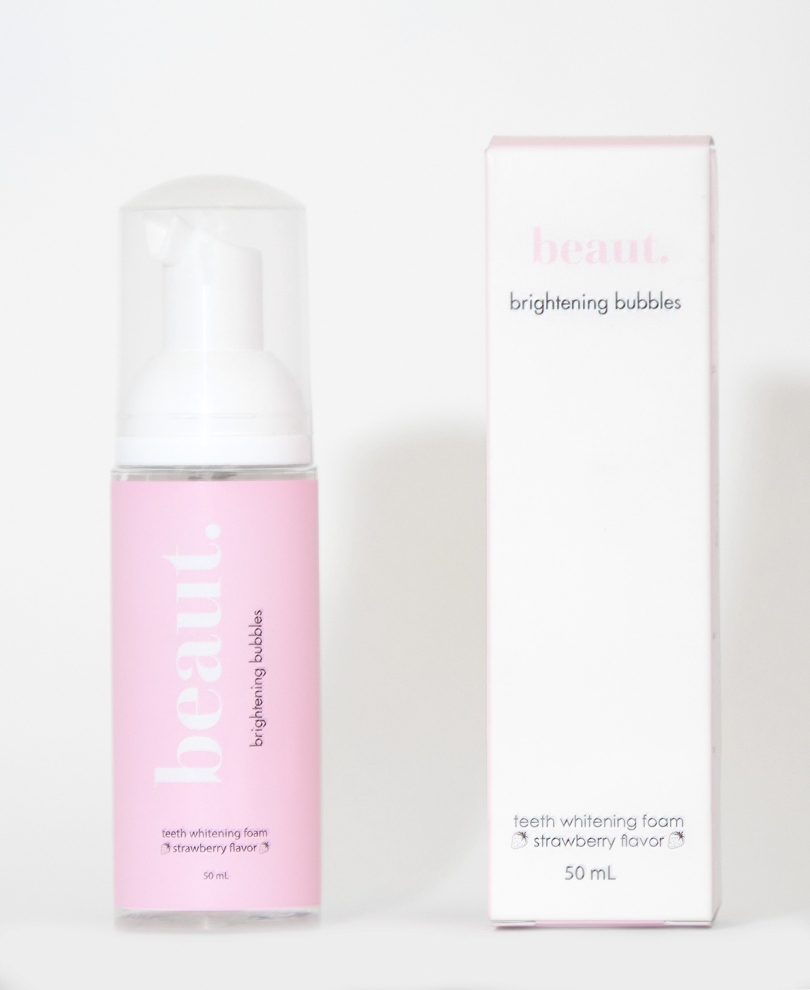 Brightening strawberry bubbles from beaut.beautyco. in a clear container, showcasing vibrant pink, foamy bubbles for skincare or bath use.