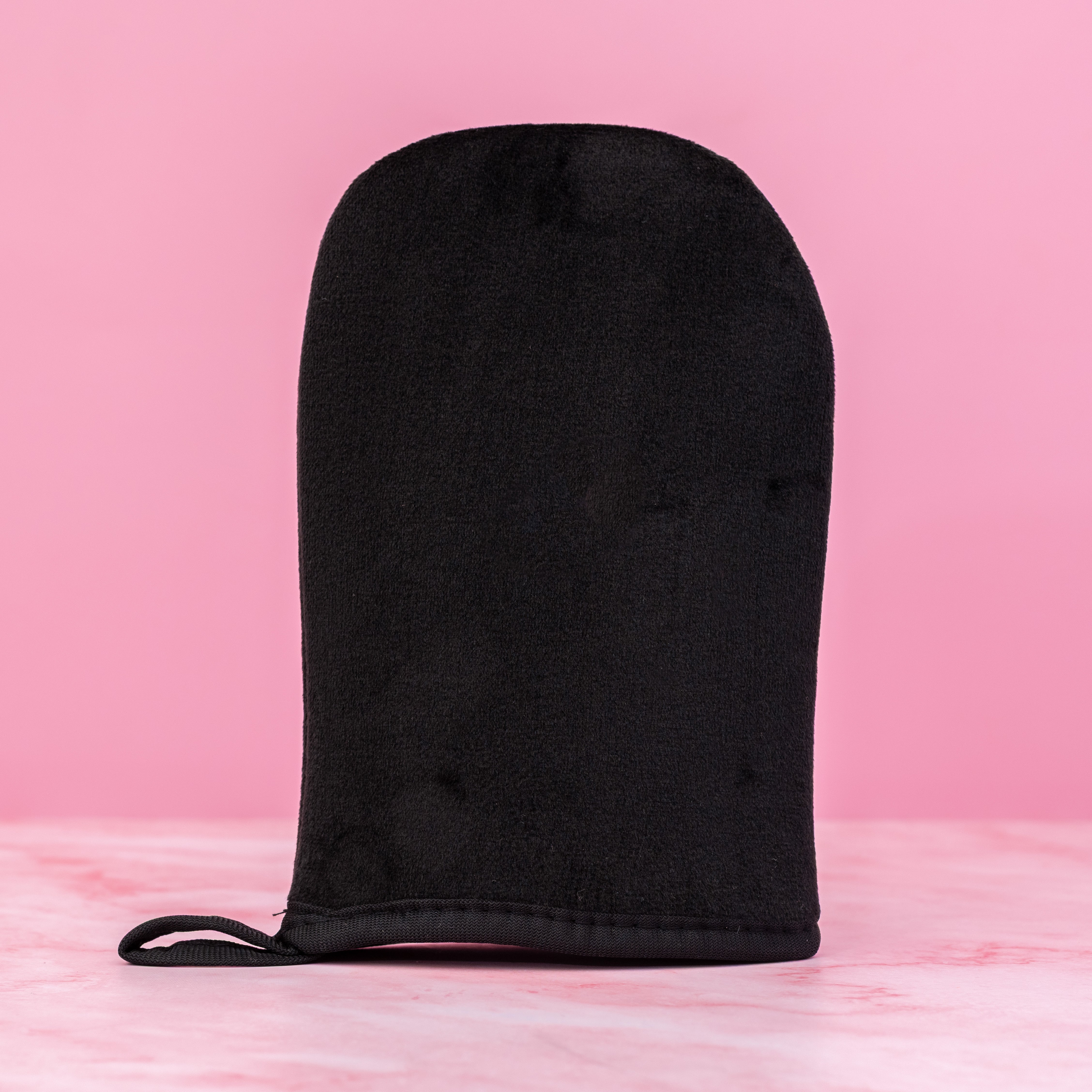 Beaut.beautyco tanning mitt for applying self-tanner, soft fabric with elastic wristband for even, smooth tanning application.