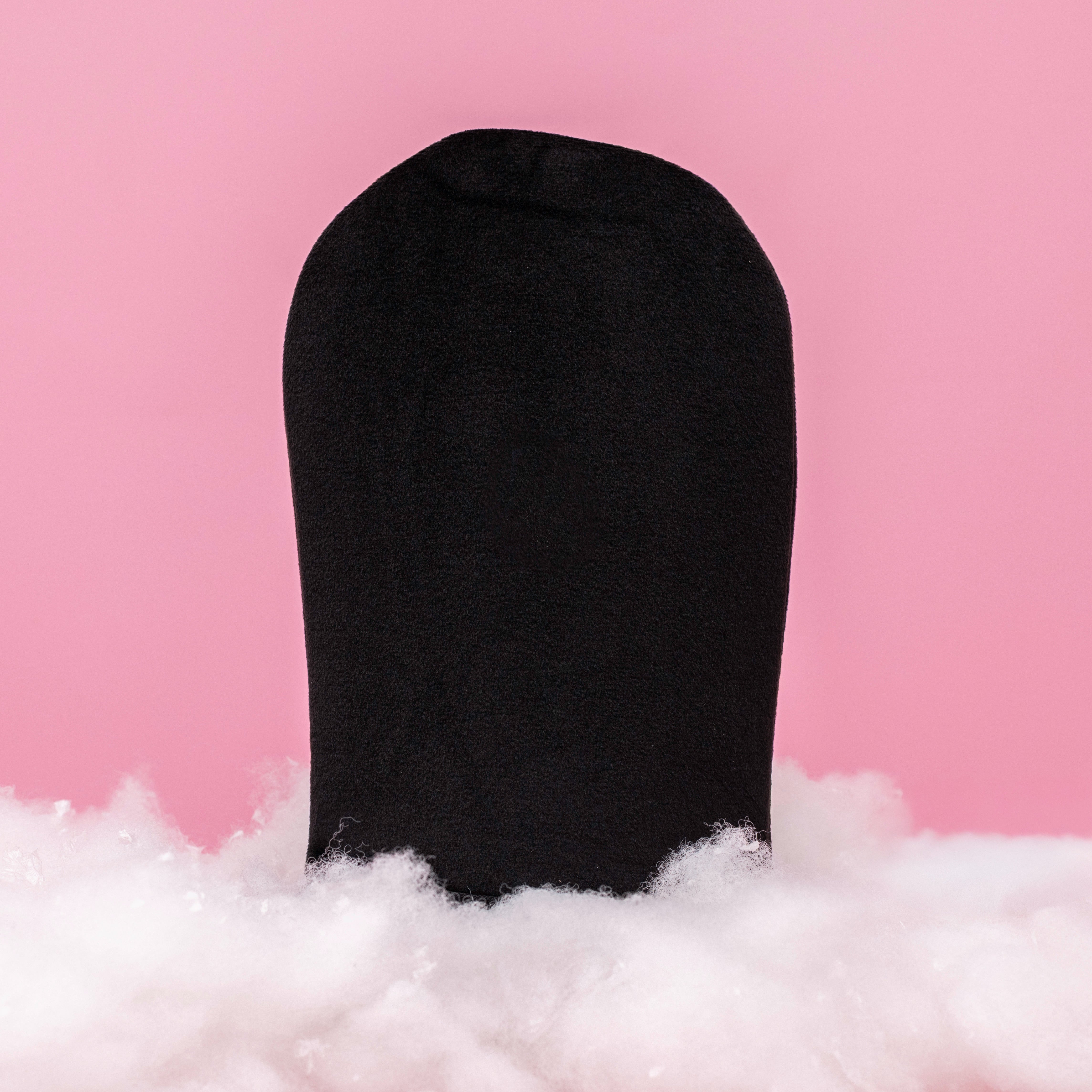 Beaut.beautyco. tanning mitt for applying self-tanner, soft fabric with a black exterior and comfortable grip.