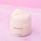 Lavender body scrub by beaut.beautyco with a textured container, showcasing a natural exfoliating product for smooth skin.