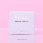 Lavender body scrub by beaut.beautyco with textured lavender-infused exfoliating particles in a clear jar.