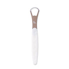 Pink tongue scraper by beaut.beautyco with a curved design for effective oral hygiene and freshening breath.
