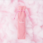 Pink tongue scraper from beaut.beautyco with a smooth, ergonomic design for oral hygiene and freshening breath.
