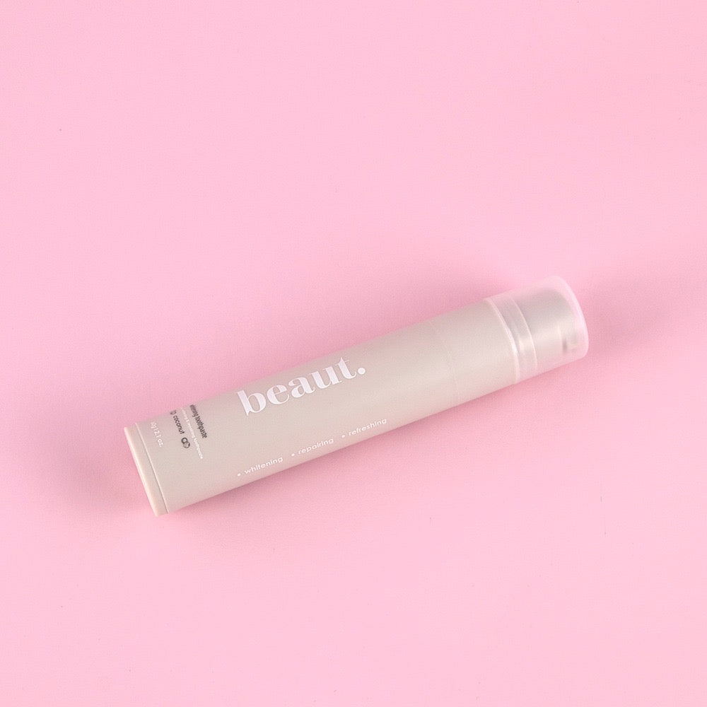 Beaut.beautyco coconut whitening toothpaste tube with fresh coconut flavor, featuring a clean and brightening dental care design.