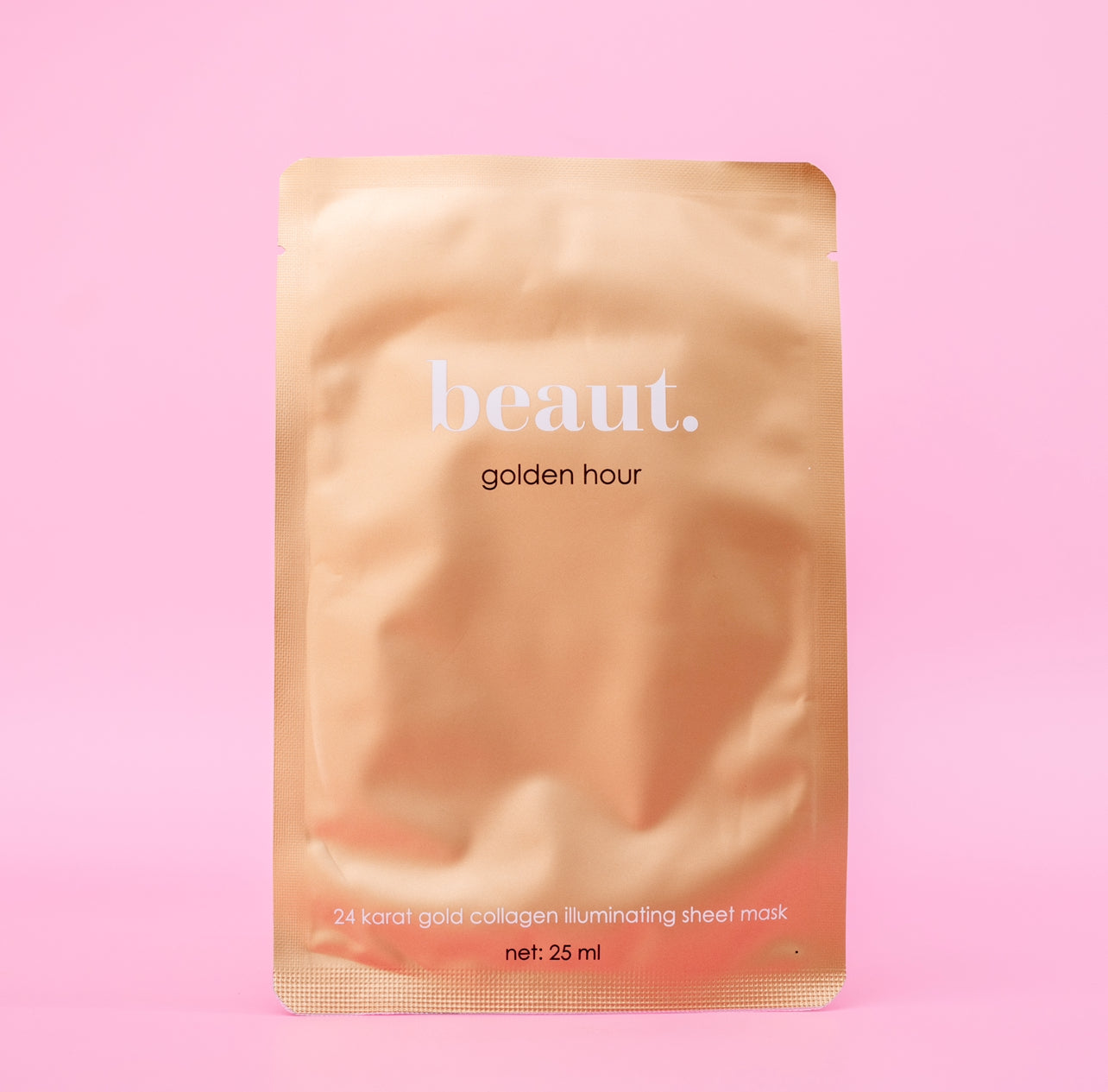 Beaut.beautyco. Golden Hour Sheet Mask showing a golden-colored sheet mask on a white background.