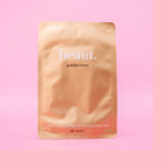 Beaut.beautyco. Golden Hour Sheet Mask showing a golden-colored sheet mask on a white background.