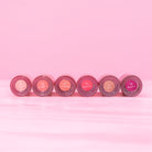 Beaut.beautyco sunkiss D lip gloss applied on lips, showcasing a glossy, vibrant finish with a smooth, shiny texture.