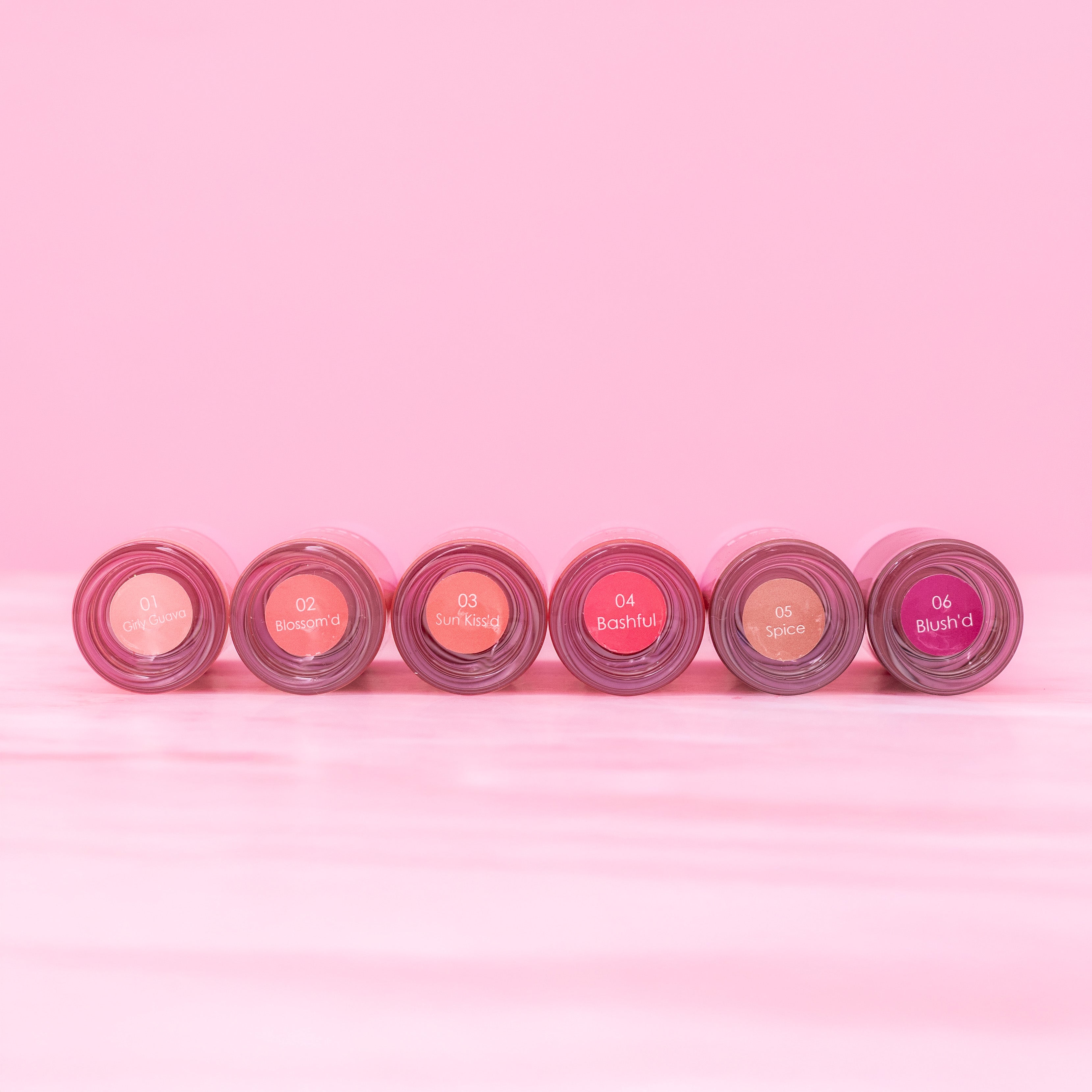 Beaut.beautyco sunkiss D lip gloss applied on lips, showcasing a glossy, vibrant finish with a smooth, shiny texture.