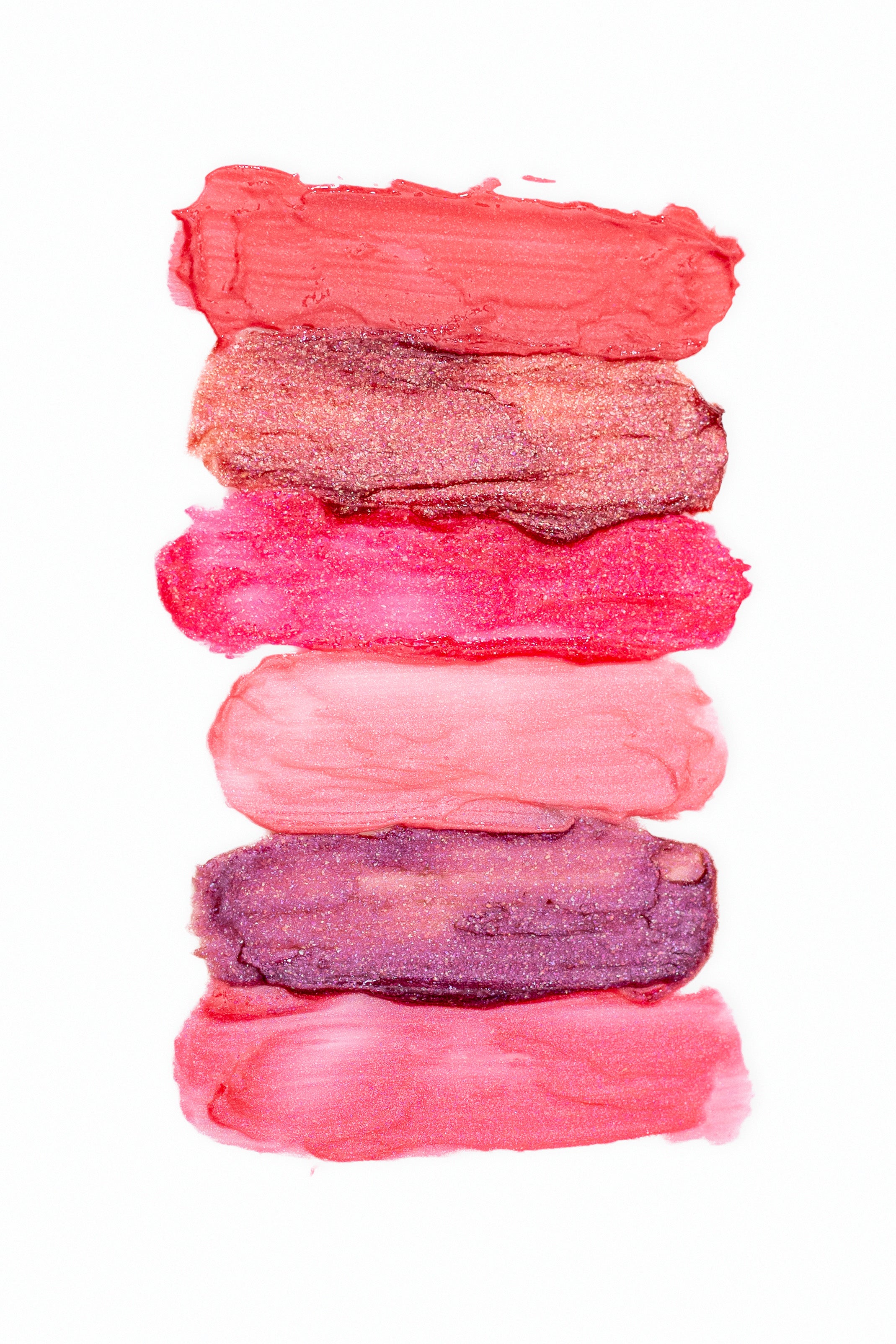Beaut.BeautyCo. Lip Gloss'd in Sunkiss D with shiny, smooth finish, featuring a clear tube and applicator wand.