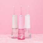 White H2O Hydroflossé water flosser by beaut.beautyco. with sleek design and multiple tips for effective oral hygiene.