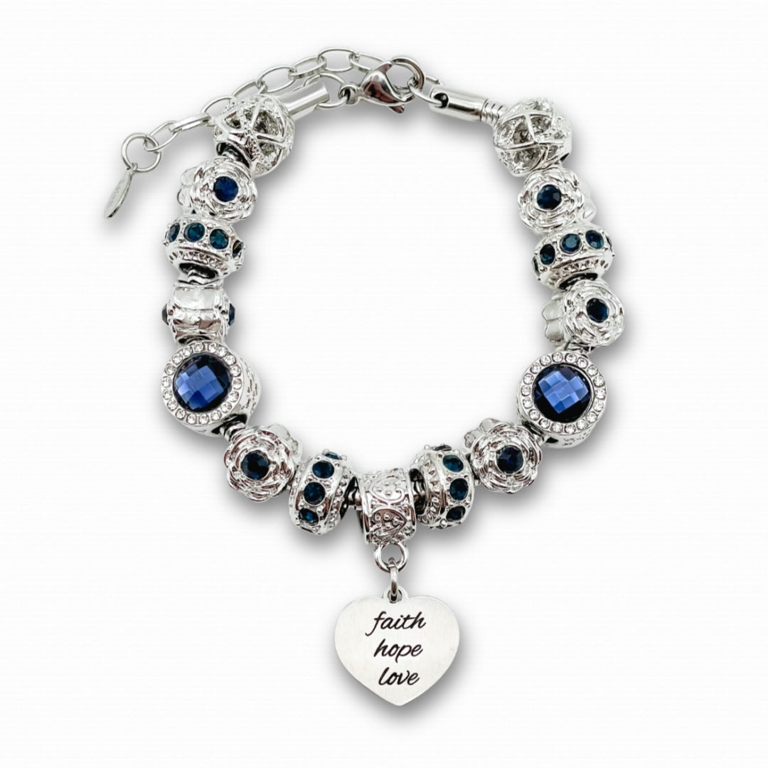 Bella's Yard Faith Hope Love bracelet featuring silver charms and beaded design on a delicate chain.
