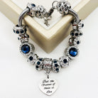 Bella's Yard Faith Hope Love bracelet featuring delicate charms and adjustable band on a neutral background.