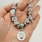 Daughter of the King bracelet by Bella's Yard, featuring a delicate chain and inspirational charm, worn on a woman's wrist.