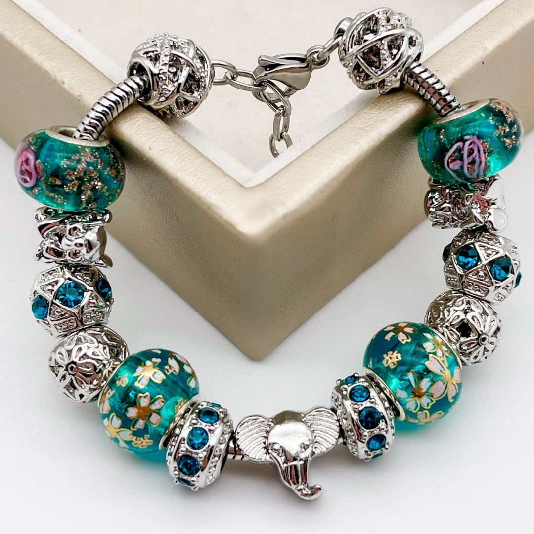 Elegant elephant love bracelet by Bella's Yard featuring detailed silver design on a delicate bracelet band.