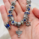 Bella's Yard Love & Light bracelet featuring beaded design with a silver charm, perfect for stacking or daily wear.