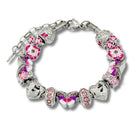 Elegant butterfly bracelet by Bella's Yard featuring delicate petal-inspired charms on a silver chain.