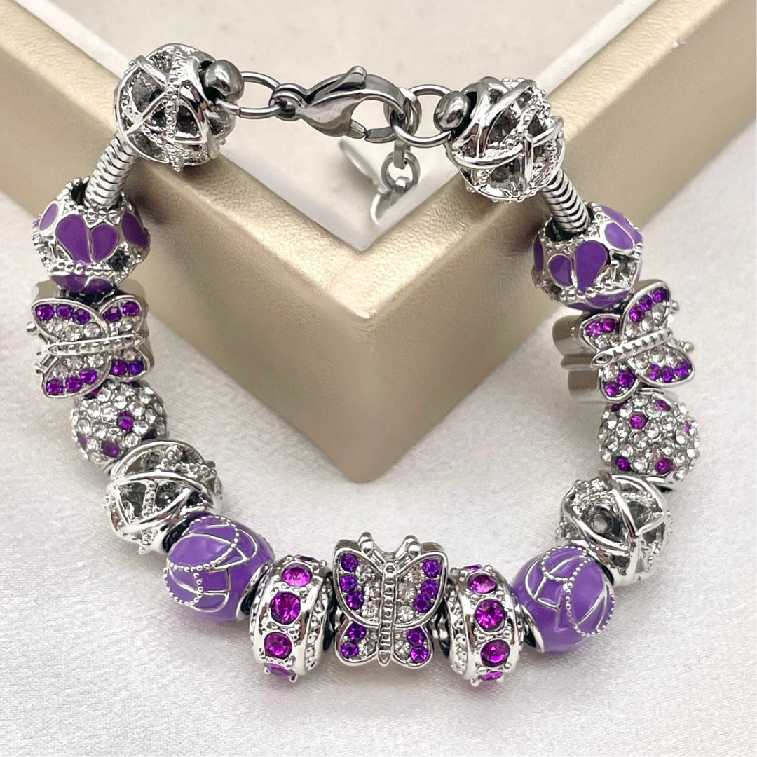 Wisteria Wings Butterfly bracelet by Bella's Yard featuring delicate butterfly charms and floral accents on a silver chain.