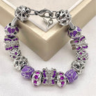 Wisteria Wings Butterfly bracelet by Bella's Yard featuring delicate butterfly charms and floral accents on a silver chain.