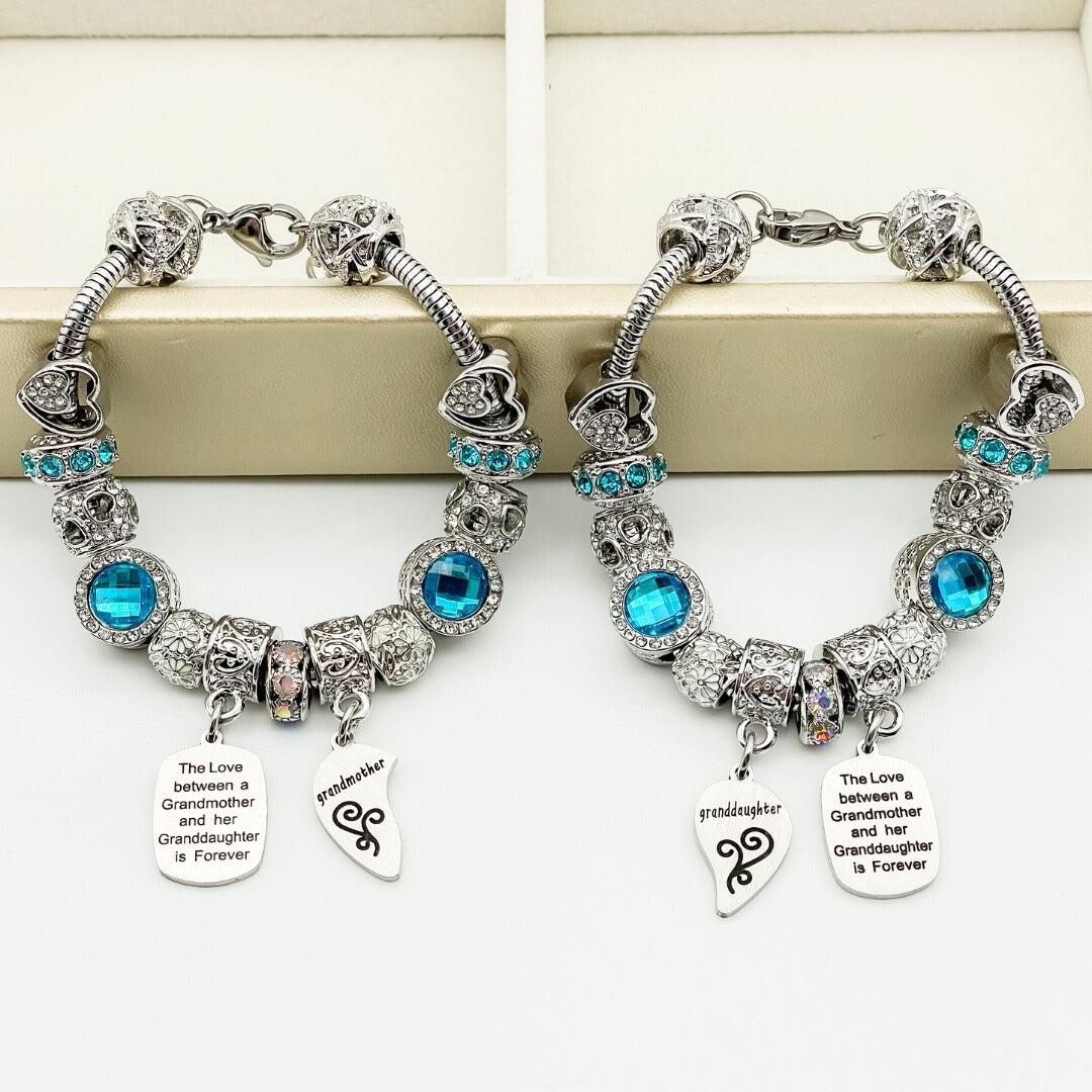Silver grandmother and granddaughter unending love bracelets from Bella's Yard, featuring intertwined heart charms and delicate chain links.
