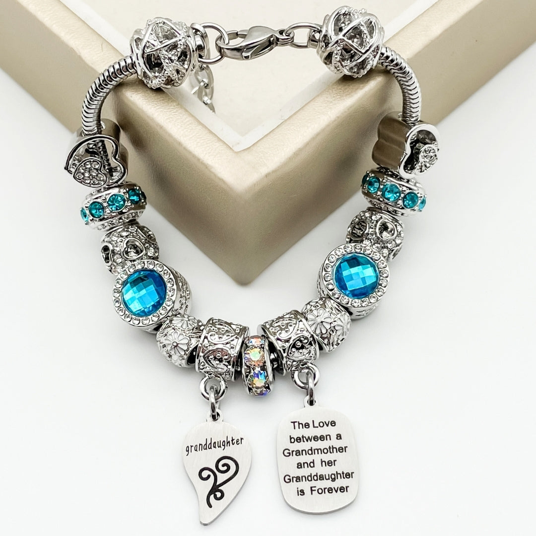 Silver grandmother and granddaughter unending love bracelets by Bella's Yard, featuring intertwined heart charms and delicate chain links.