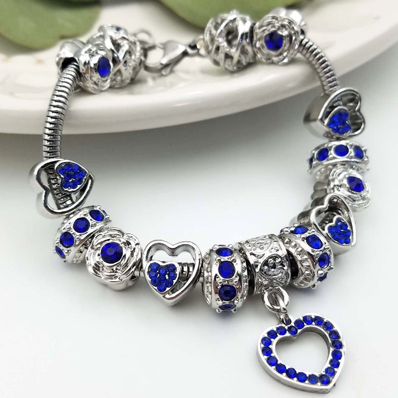Elegant birthstone bracelet by Bella's Yard featuring September's sapphire gemstone and delicate silver chain.