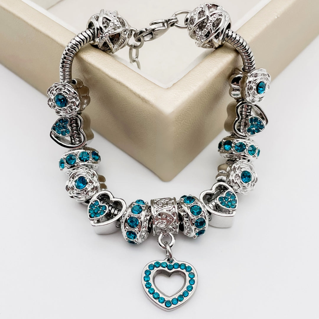 Colorful birthstone bracelets by Bella's Yard featuring vibrant gemstones and delicate chain designs.