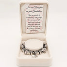 Graduation bracelet from Bella's Yard with "You Did It" and "Our Daughter" charms, featuring silver-tone design and engraved details.