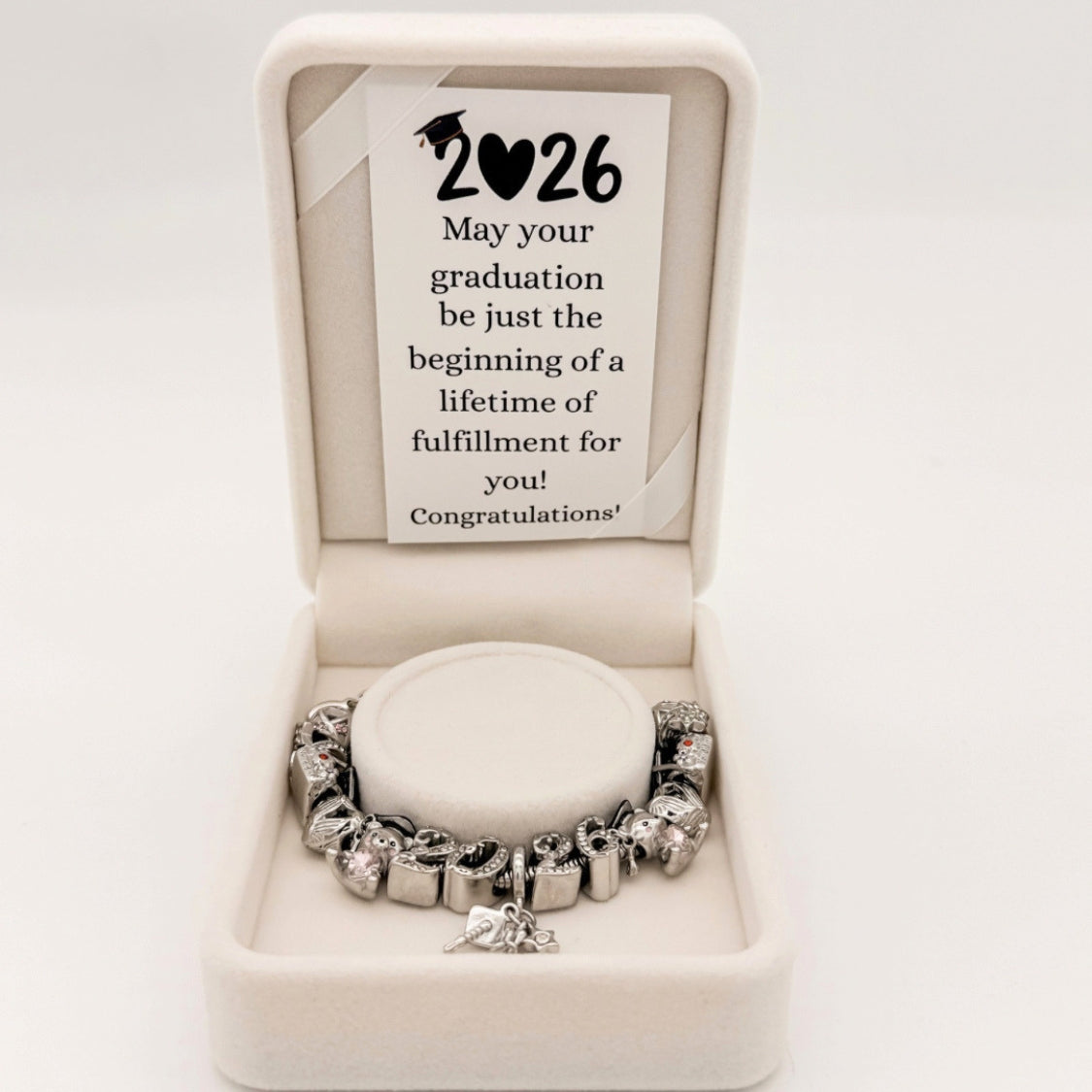 Bella's Yard You Did It Graduation Bracelet featuring a silver band and engraved graduation message for 2026.