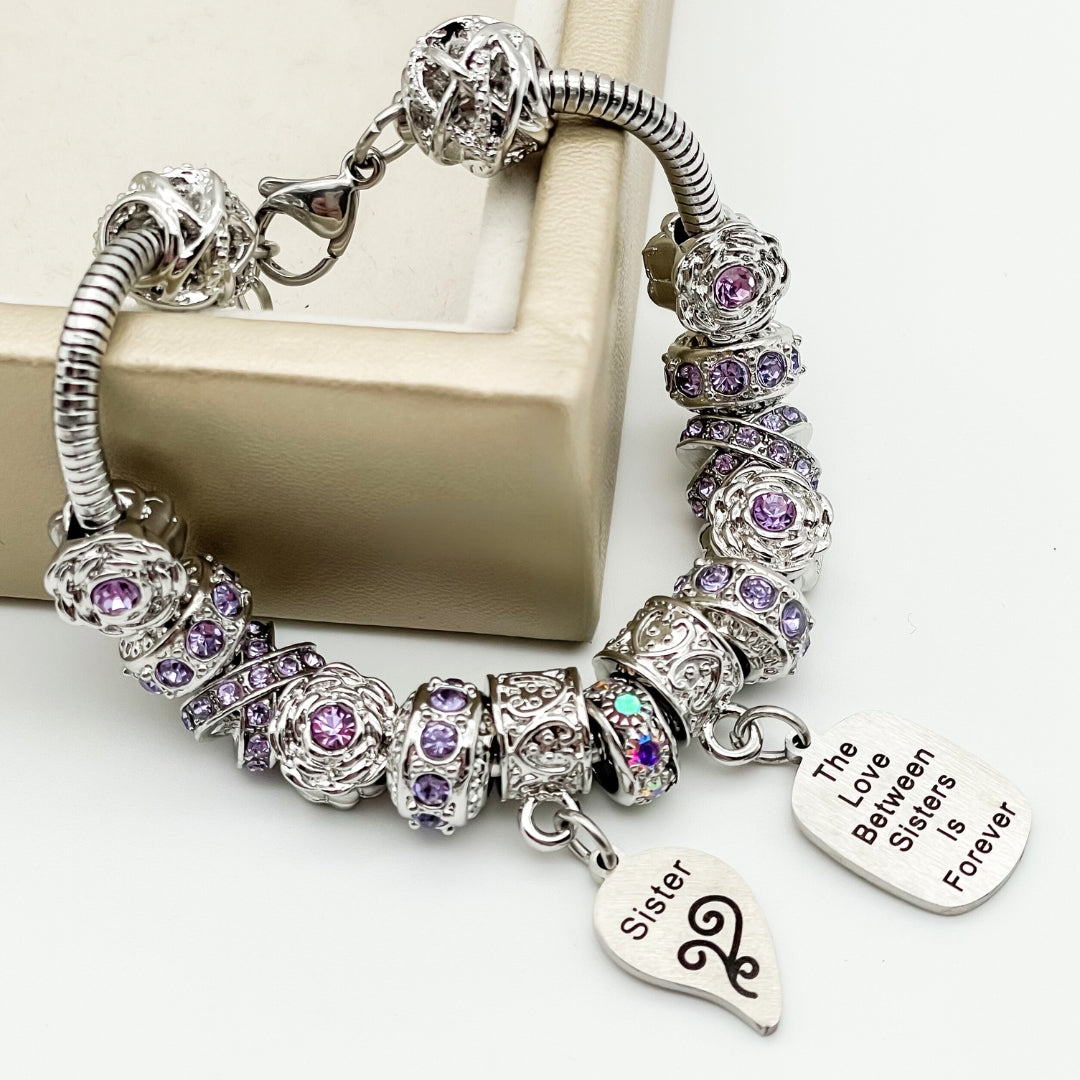 Bella's Yard Sisters Infinite Love bracelet featuring a delicate silver chain and infinity charm on a neutral background.