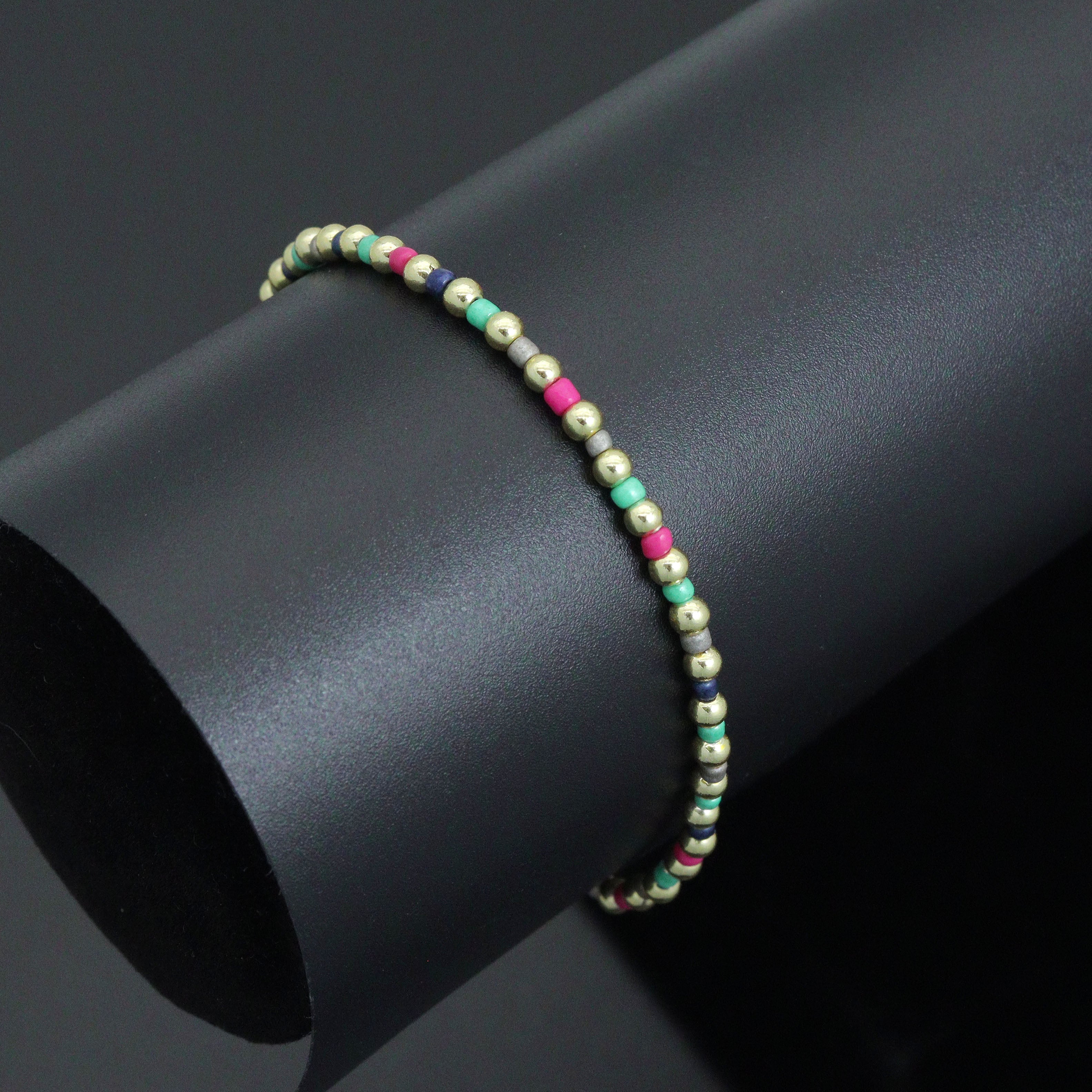 Colorful 7-inch rainbow hematite stretchy bracelet by Bestbeads&Beyond featuring vibrant rainbow beads on a flexible elastic band.