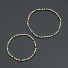 7-inch Rainbow Hematite Stretchy Bracelet by Bestbeads&Beyond featuring colorful rainbow hematite beads on an elastic band.